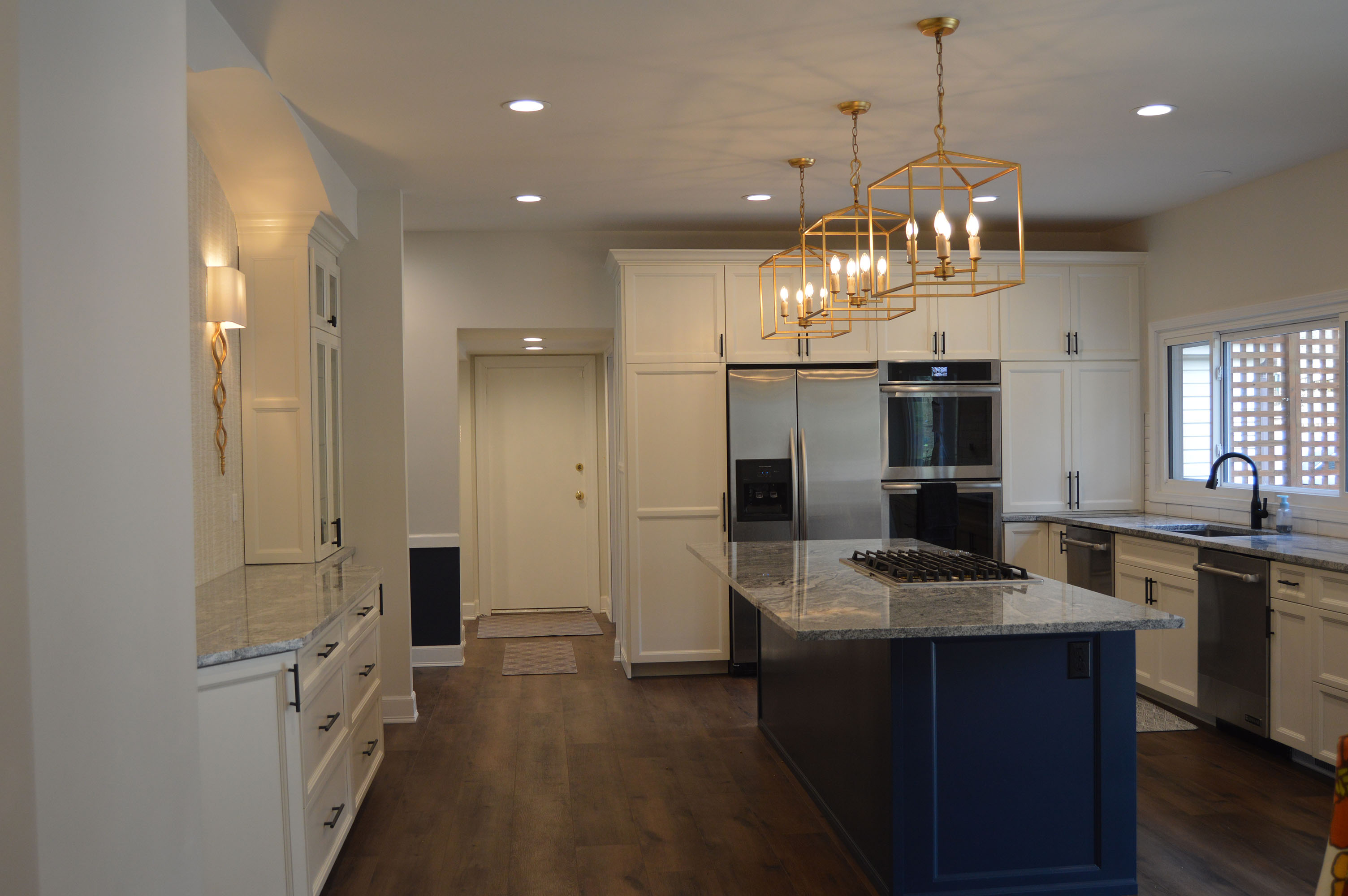 Kitchen remodel with colored island accent - custom woodwork